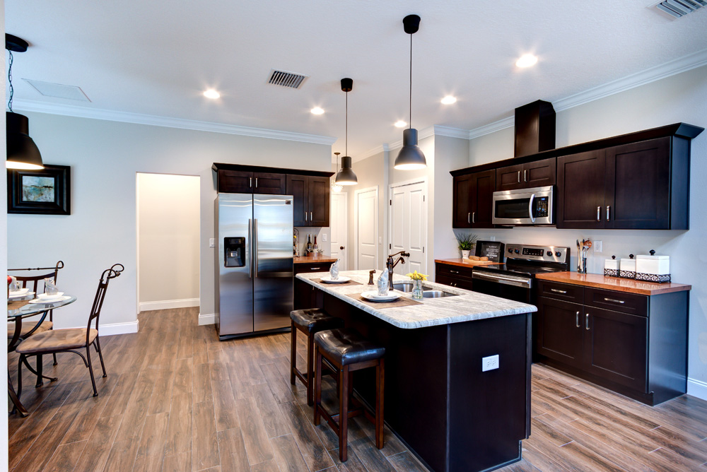kitchen with white countertop and deep brown cabinets
