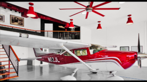 Hangar home with red passenger plane parked in garage with matching red overhead lights and ceiling fan