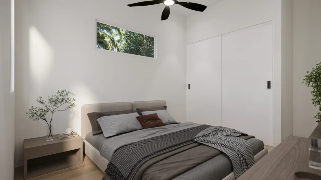 Guest bedroom in the Carrie model with an upholstered bed and built-in closet at Six in the City, College Park, Orlando