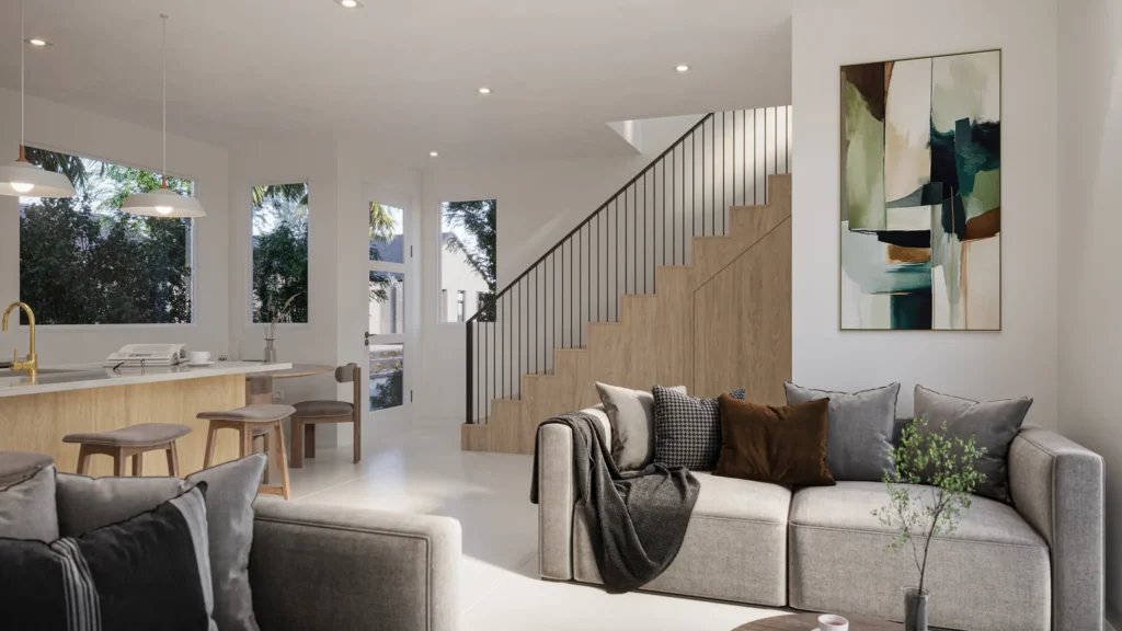 Carrie model living room with a custom wood staircase and abstract art at Six in the City in College Park, Orlando