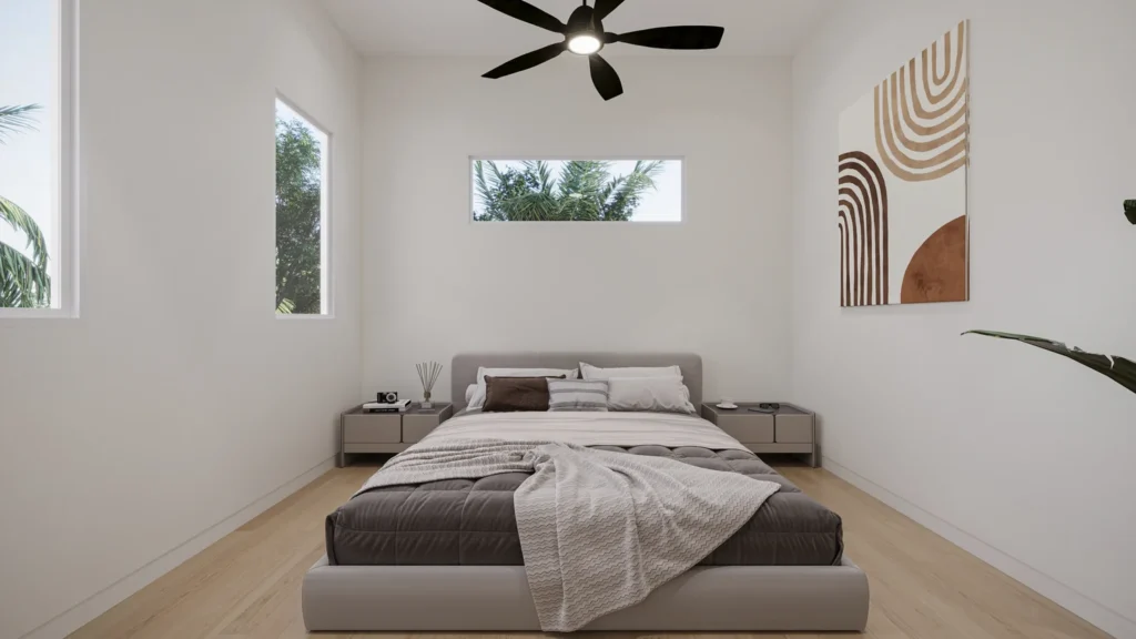 Primary bedroom in the Carrie model with earth-toned decor and natural light at Six in the City, College Park, Orlando