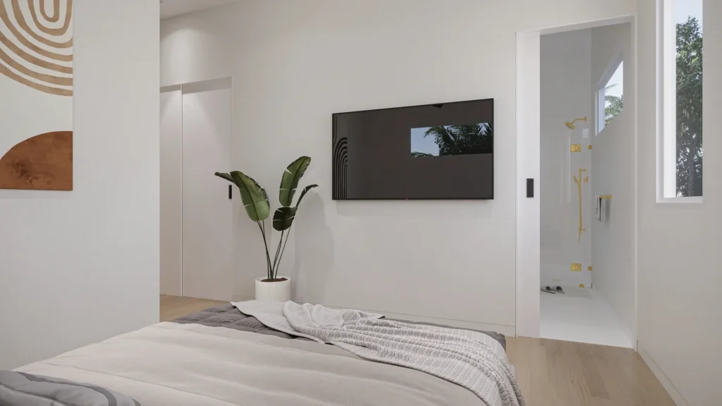 Carrie model primary bedroom with a wall-mounted TV and ensuite bathroom at Six in the City in College Park, Orlando