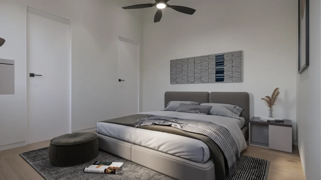 Primary bedroom in the Charlotte model with an upholstered bed and neutral palette at Six in the City, College Park, Orlando