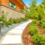 stepping stone garden walkway with landscape lighting at japandi home