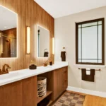 japandi bathroom with frameless cabinetry, wood finishes, and modern fixtures