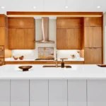 custom kitchen cabinetry with built in wall ovens and modern wood finish