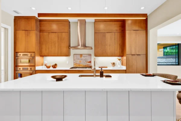 custom kitchen cabinetry with built in wall ovens and modern wood finish