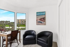 Renovated condo office with white shiplap accent wall and coastal finishes completed by Newberry Homes in New Smyrna Beach, Florida.