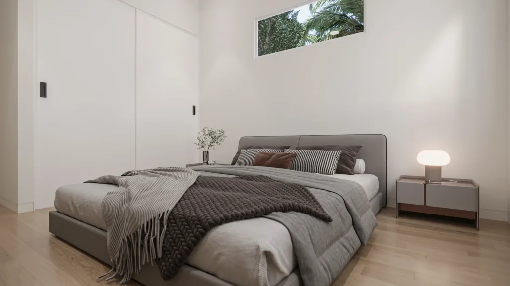 Guest bedroom in the Samantha model with an upholstered bed and built-in closet at Six in the City, College Park, Orlando