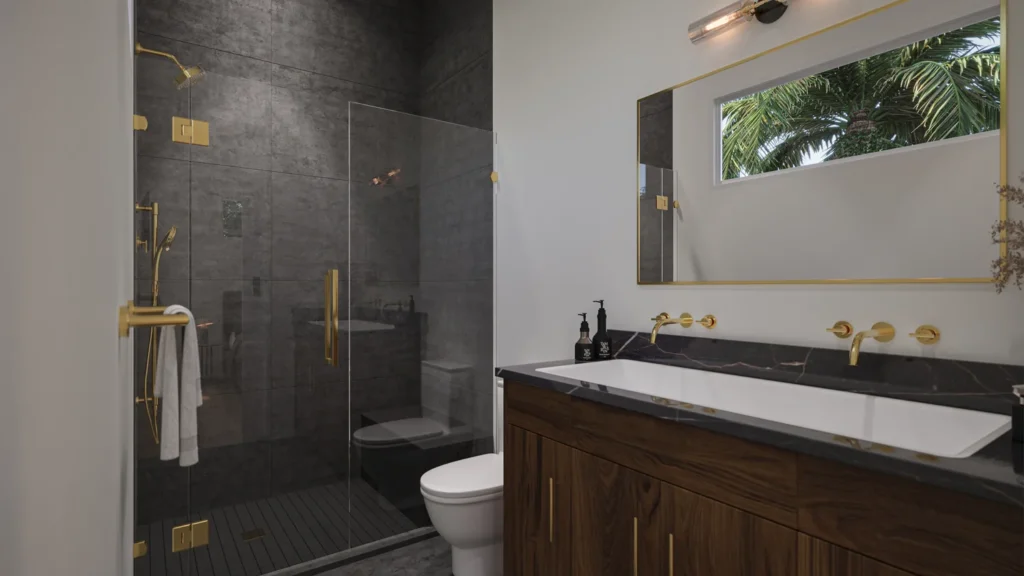 Samantha model primary bathroom with a dark-tile walk-in shower, gold fixtures, and walnut vanity at Six in the City, College Park Orlando