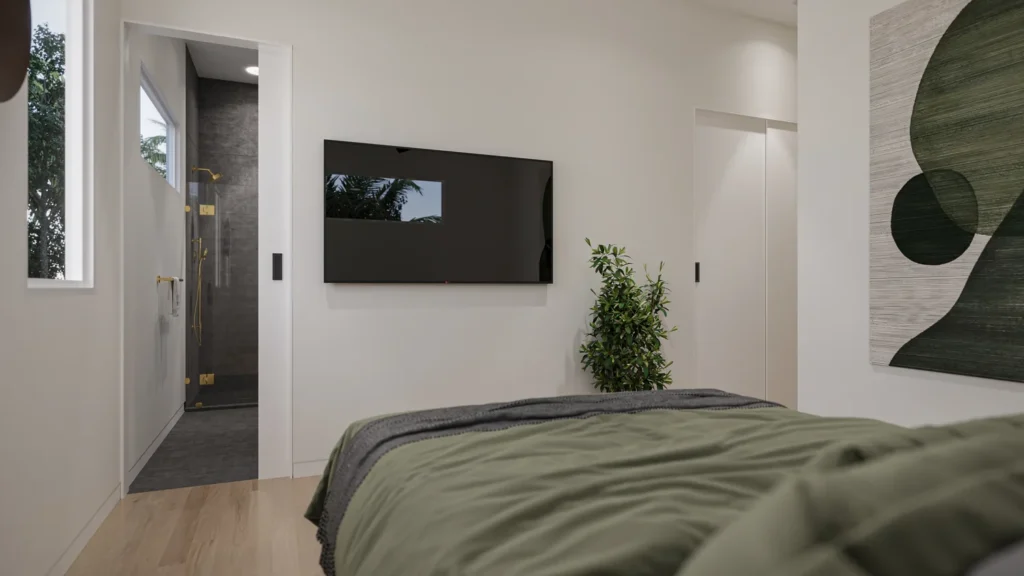 Samantha model primary bedroom with a wall-mounted TV and ensuite bathroom at Six in the City in College Park, Orlando
