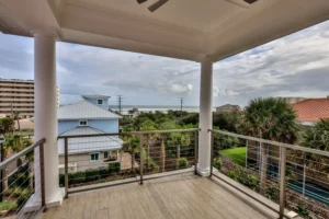 Covered oceanfront balcony of The Mallory custom home by Newberry Homes overlooking the Atlantic in Ponce Inlet, Volusia County, FL